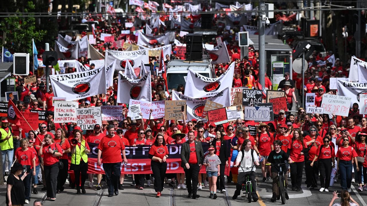 Protesters march during a strike by public school teachers,