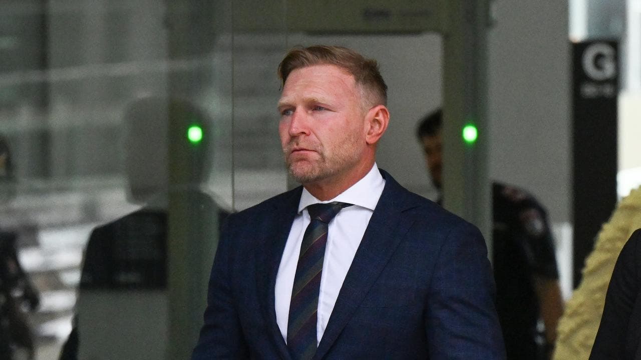 man in suit leaves court