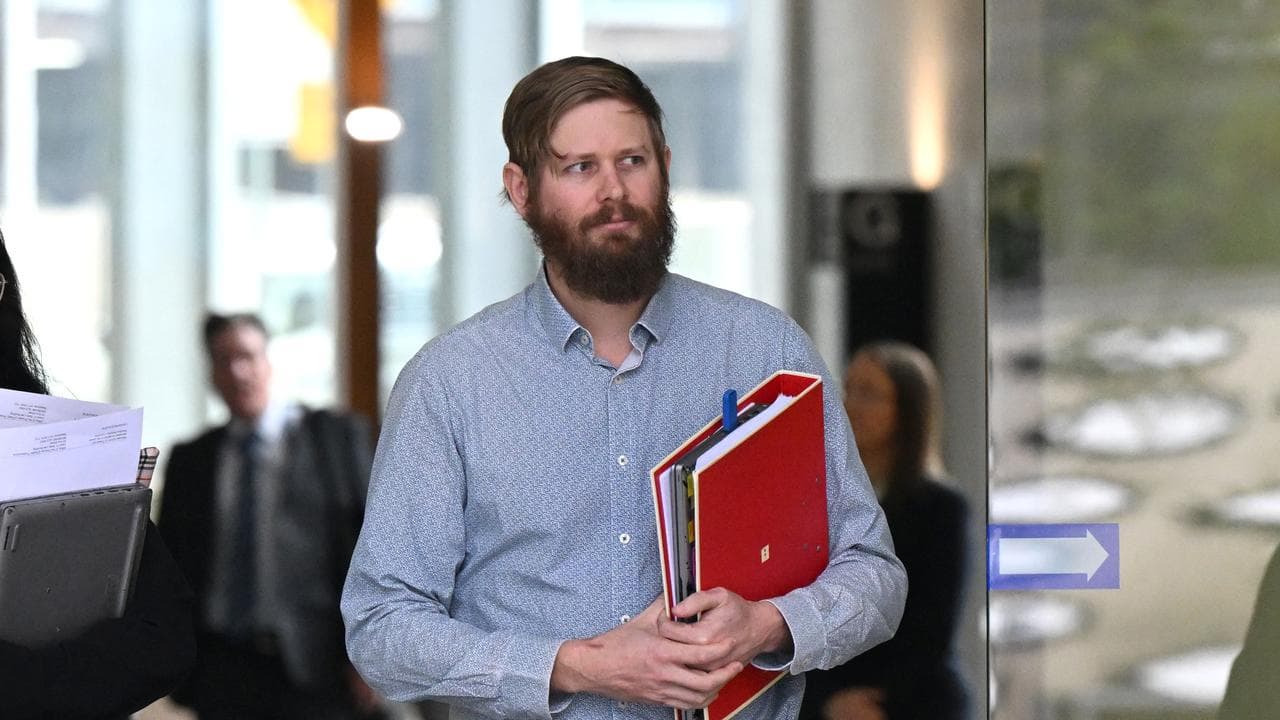 man with folder leaves courthouse
