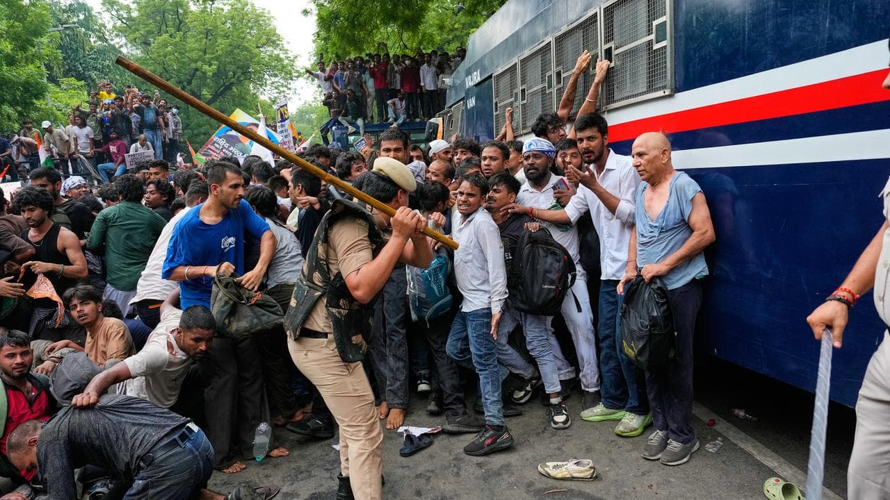Police use batons to disperse supporters of the Cockroach Janta Party