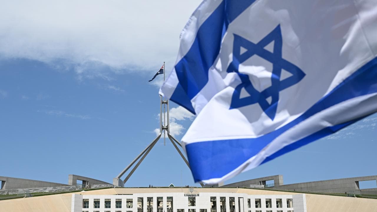 The flag of Israel flies near Parliament House