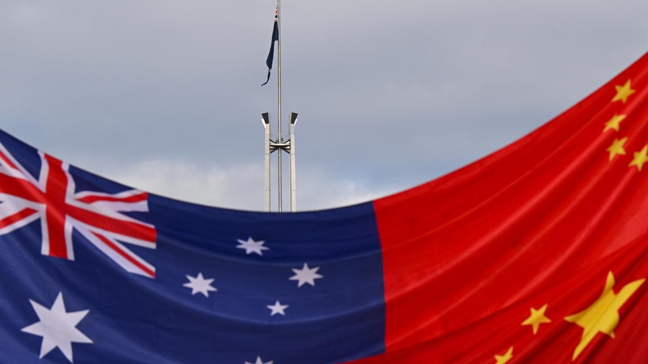 An Australian and a Chinese flag in Canberra