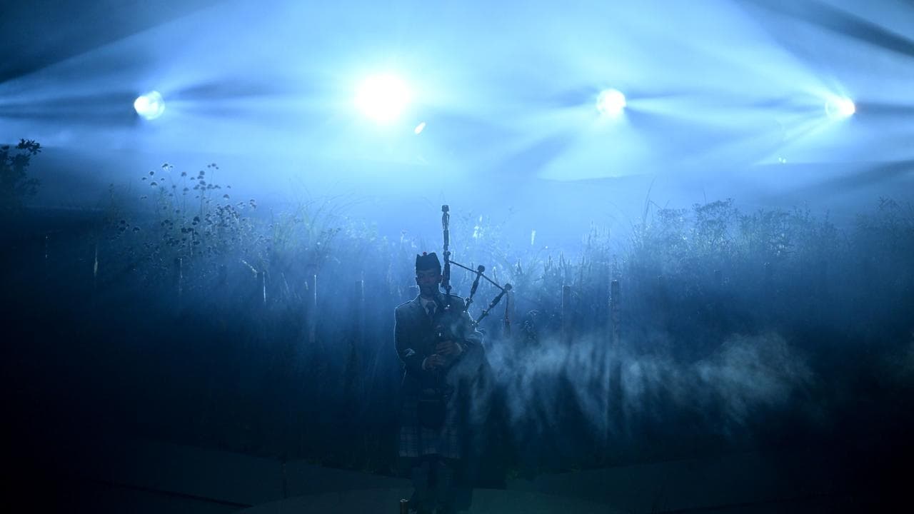 A bagpiper during the Opening C