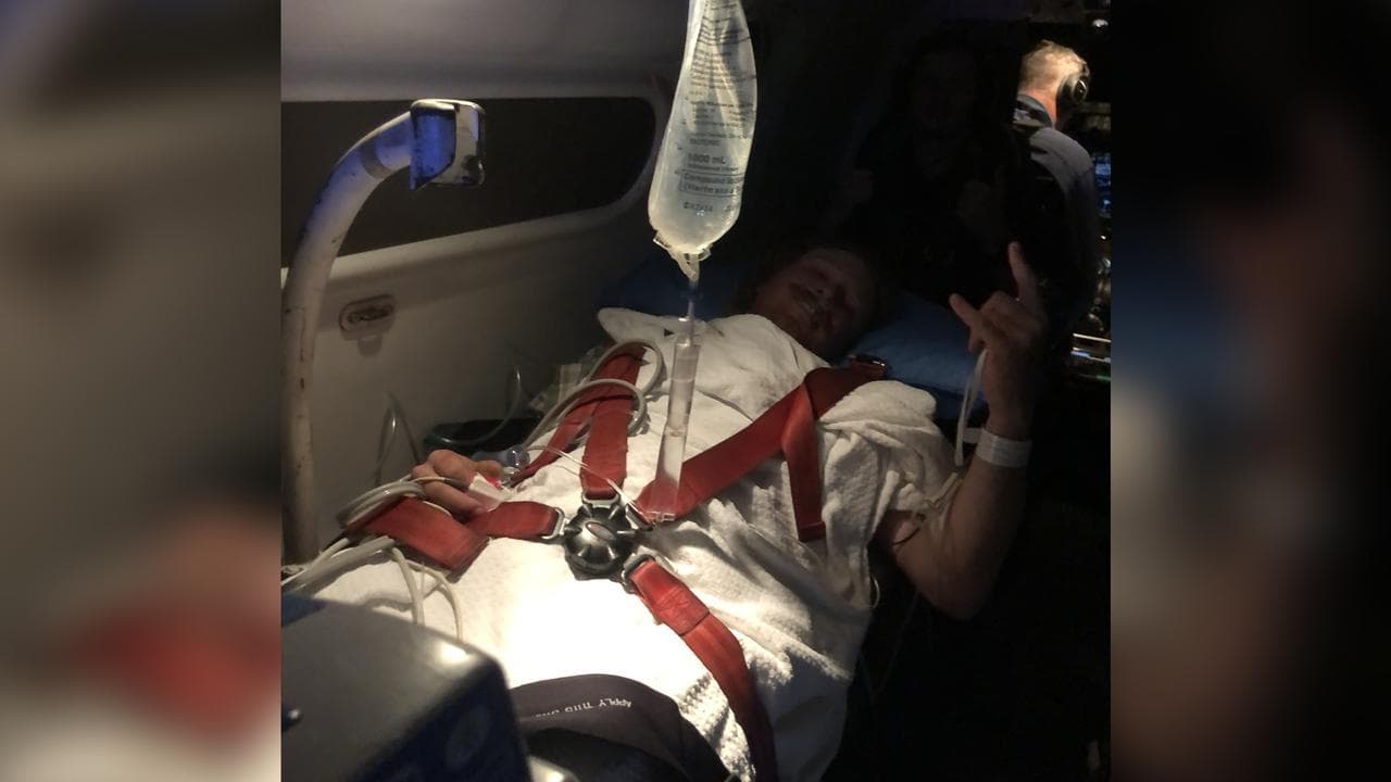 Farmhand Patrick Blomfield on a RFDS emergency flight