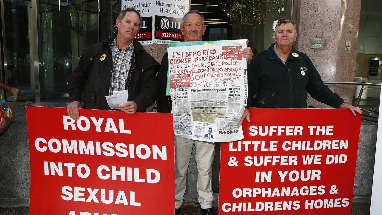 Placards at the royal commission in 2014