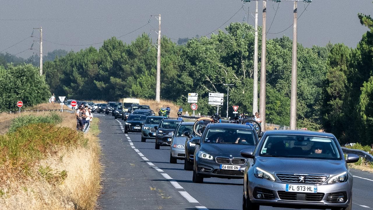 People leave the Ares region during wildfires, western France