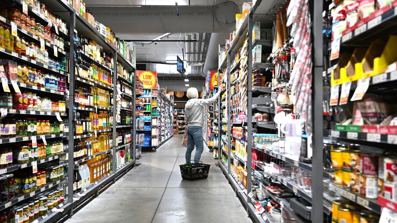 A woman is seen shopping at a supermarket