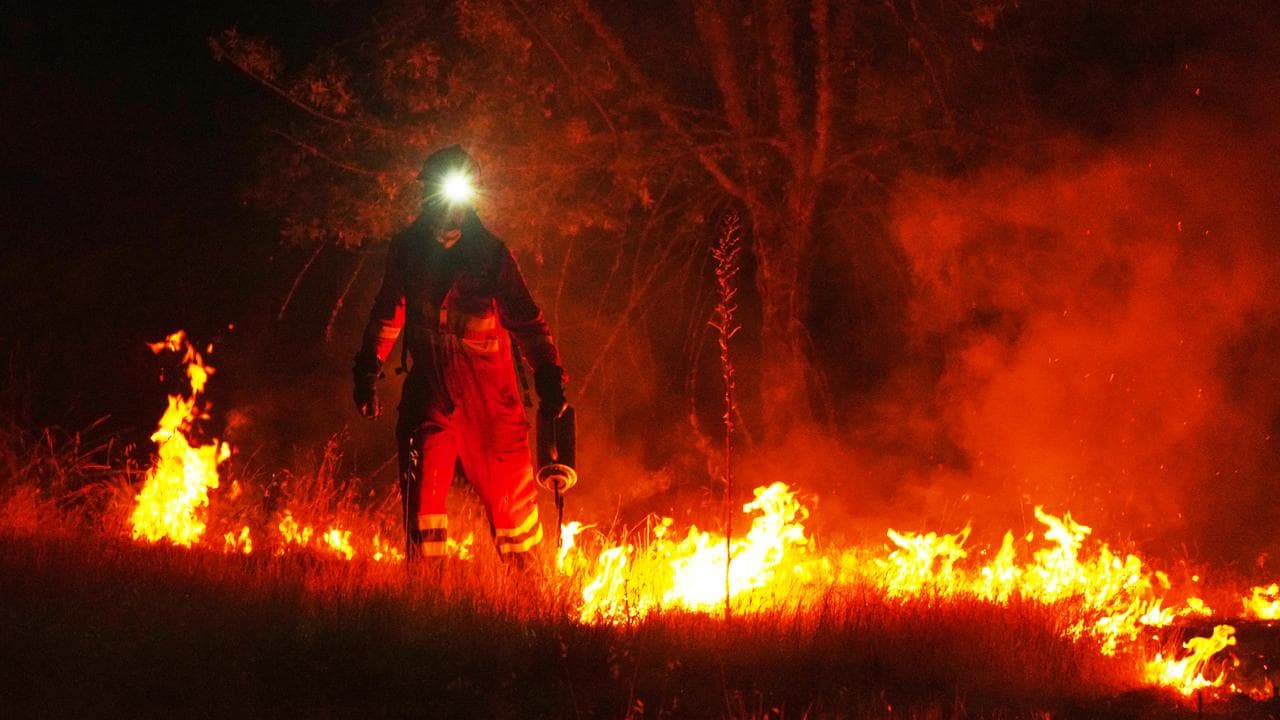 Firefighters use controlled burning in Avila province, Spain