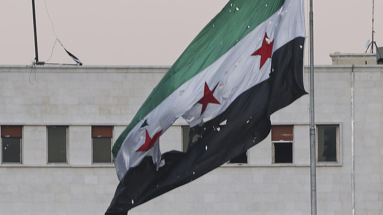 A torn Syrian flag