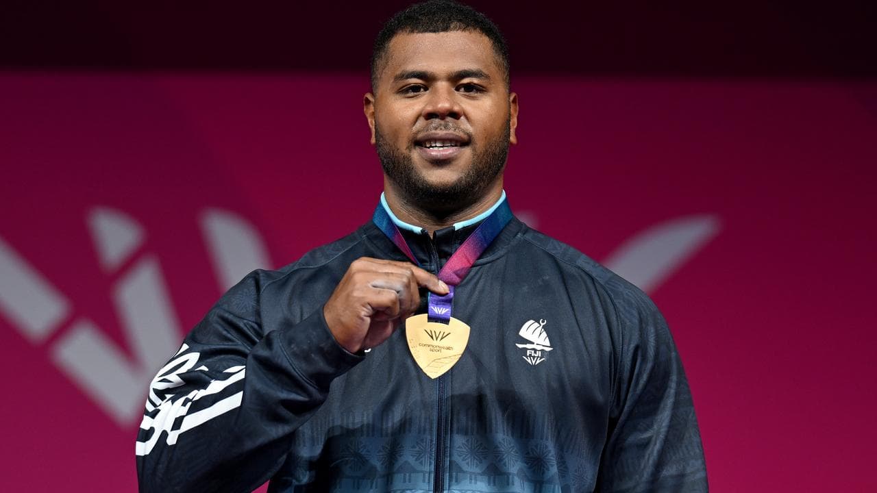 Taniela Tuisuva Rainibogi of Fiji is presented with the Gold medal.