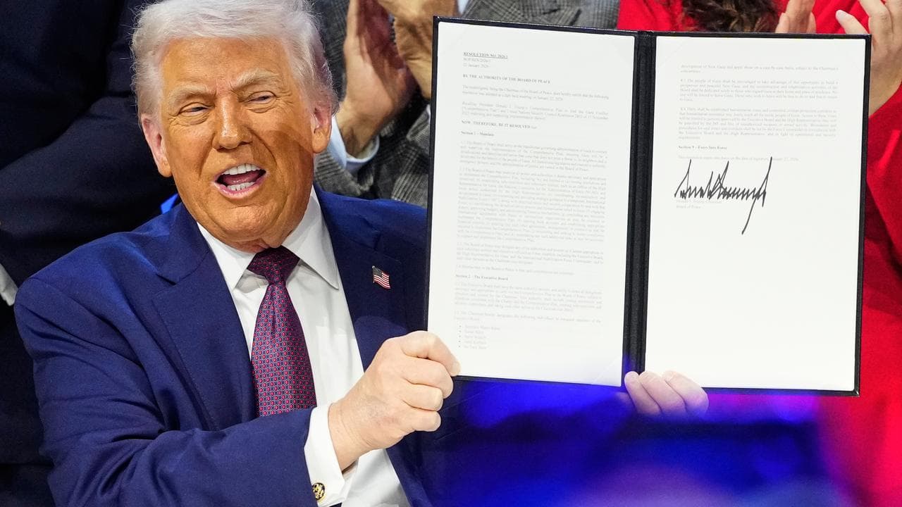 Donald Trump holds signed charter of his Board of Peace