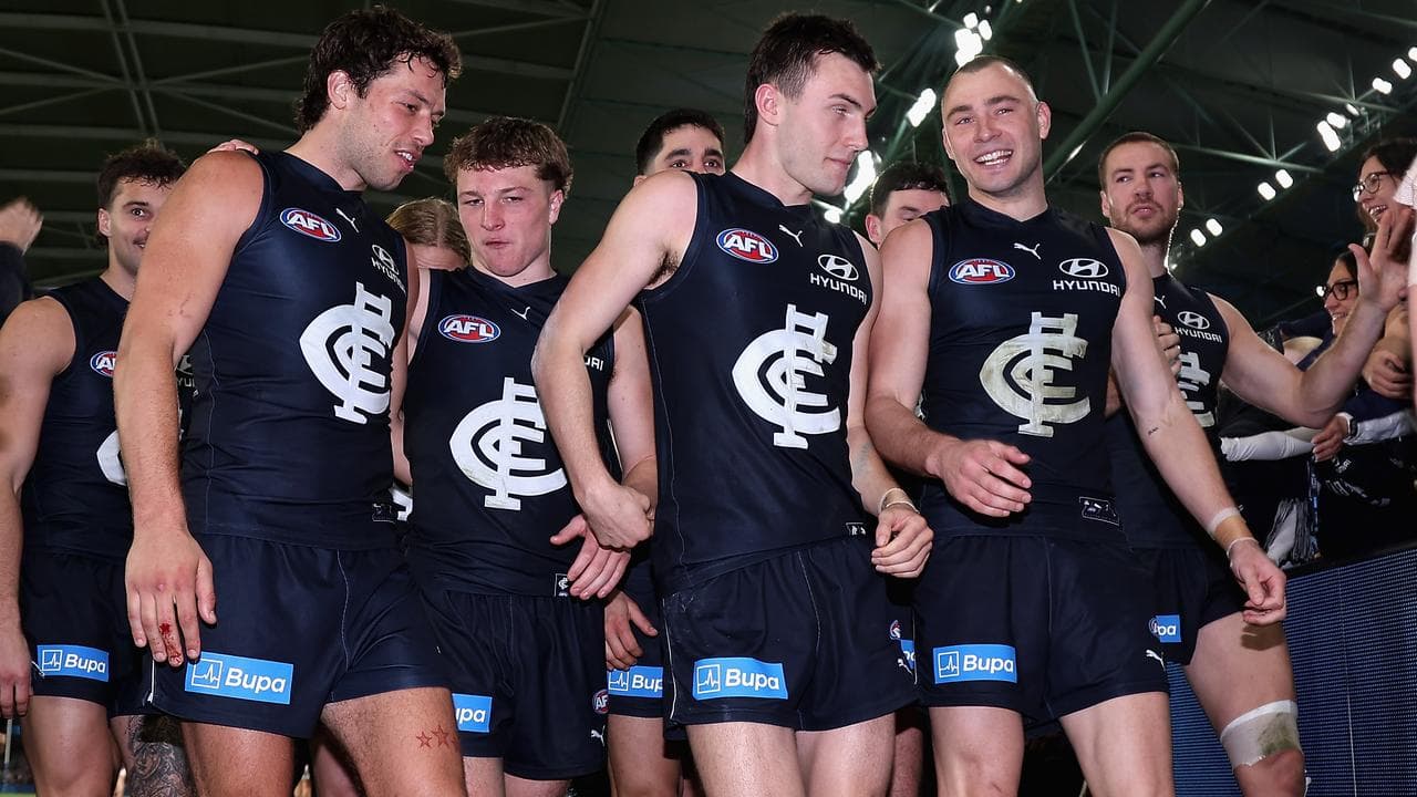 Carlton Blues players celebrate.
