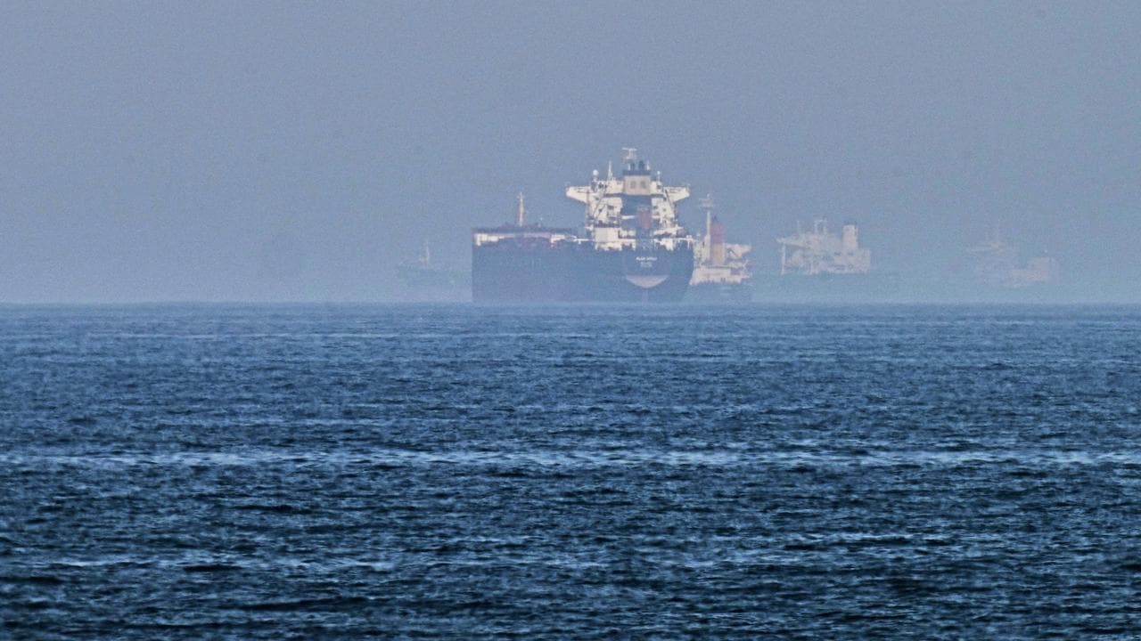 Cargo ships are seen at sea near the Strait of Hormuz