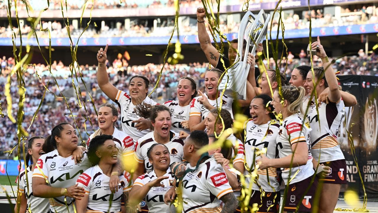 Brisbane players celebrate premiership win
