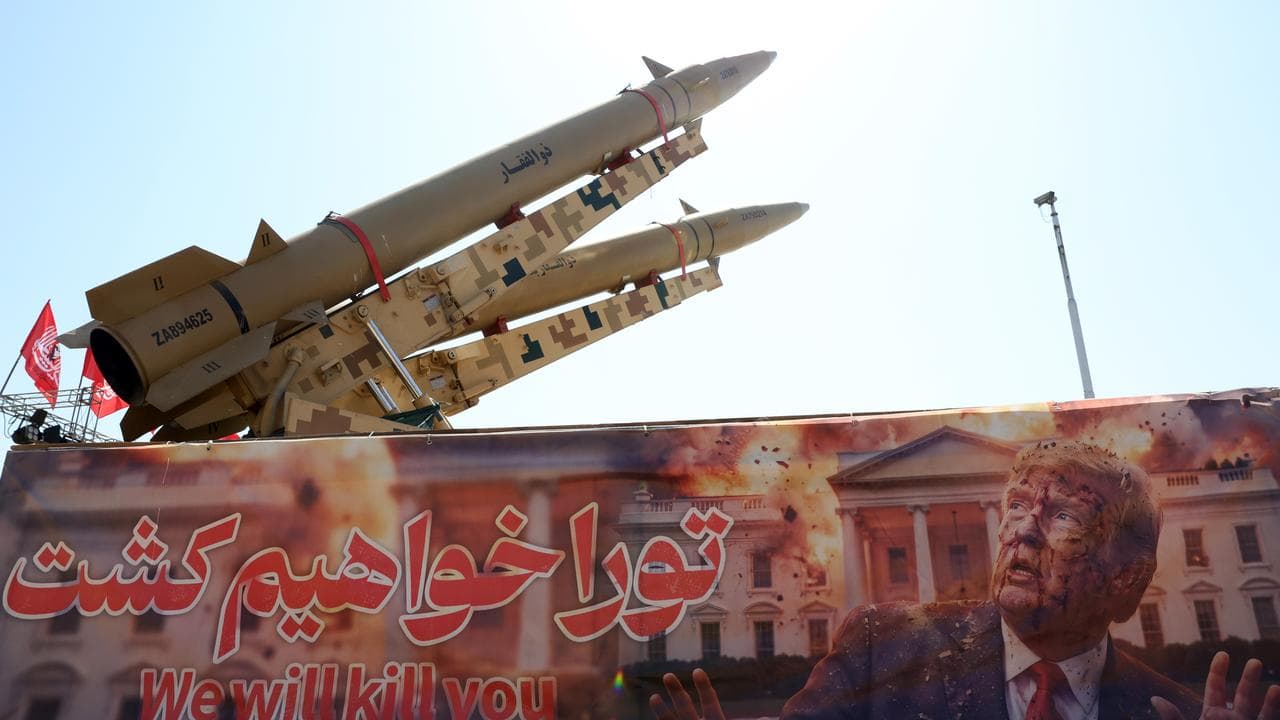 Iranian missiles and an anti-US and Donald Trump banner in Tehran