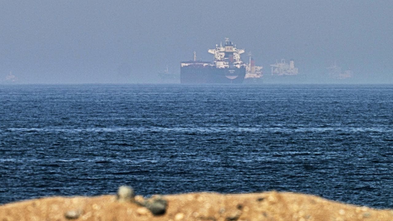 Cargo ships are seen at sea near the Strait of Hormuz