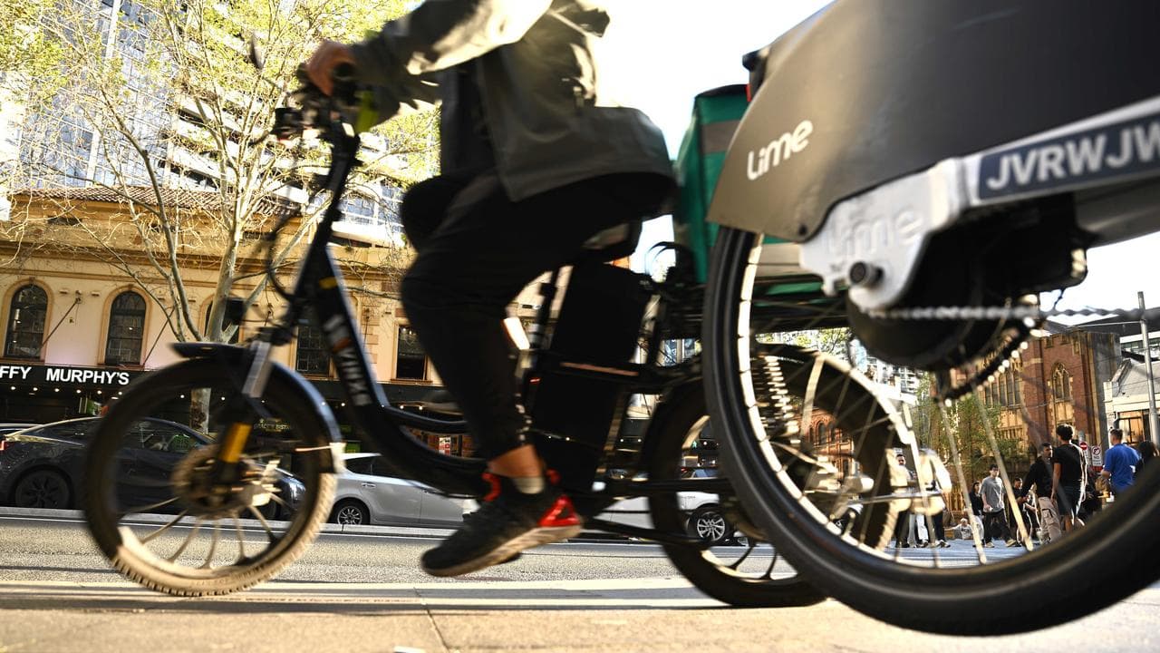 People riding e-bikes in Sydney (file image)