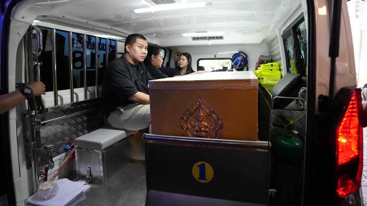 A coffin containing the body of a school shooting victim in Thailand
