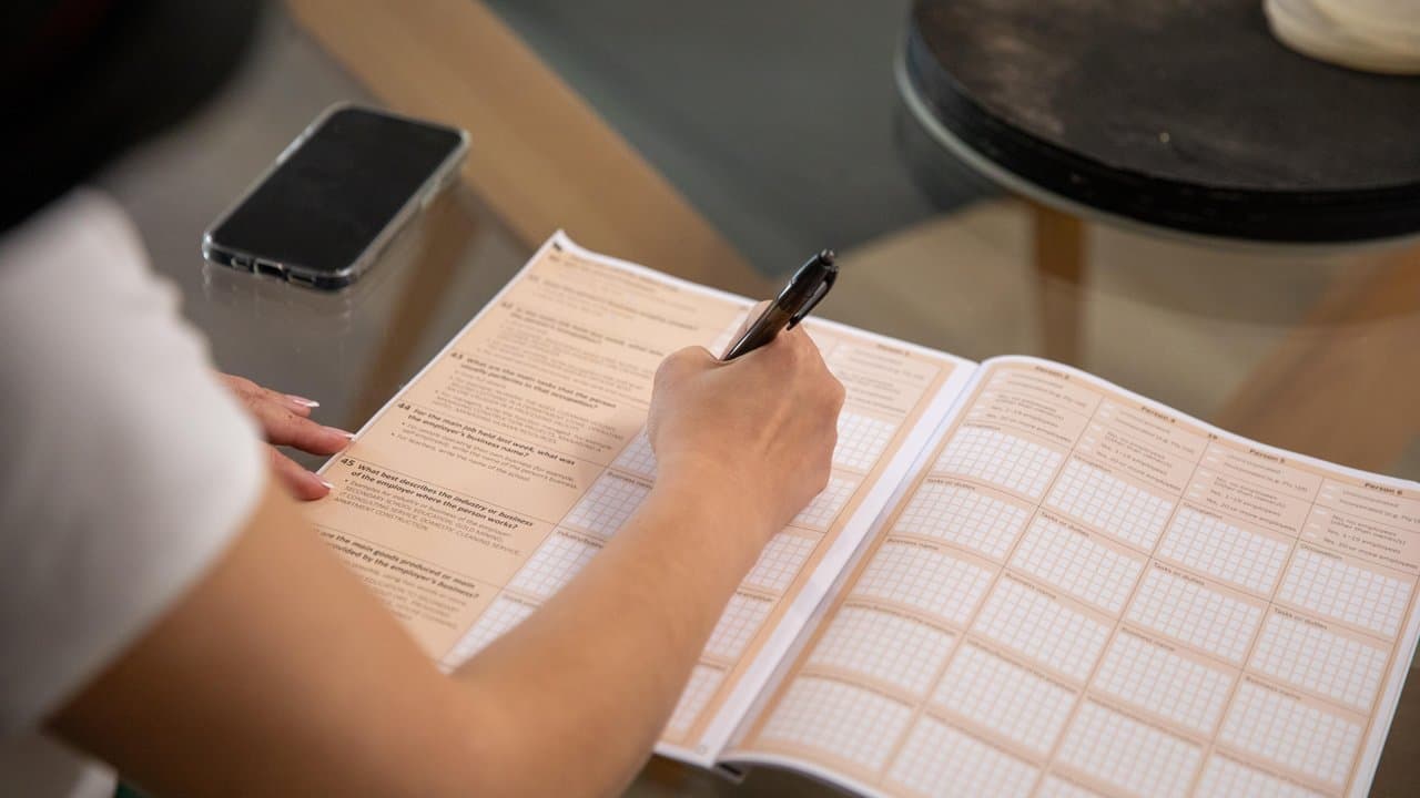 A woman filling in the census