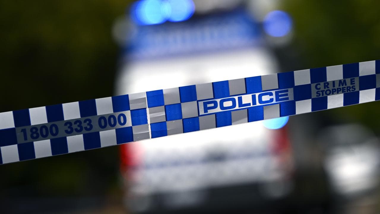 Police tape and vehicle