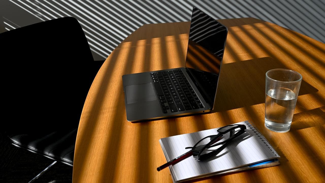 A laptop on a work desk inside an office (file image)