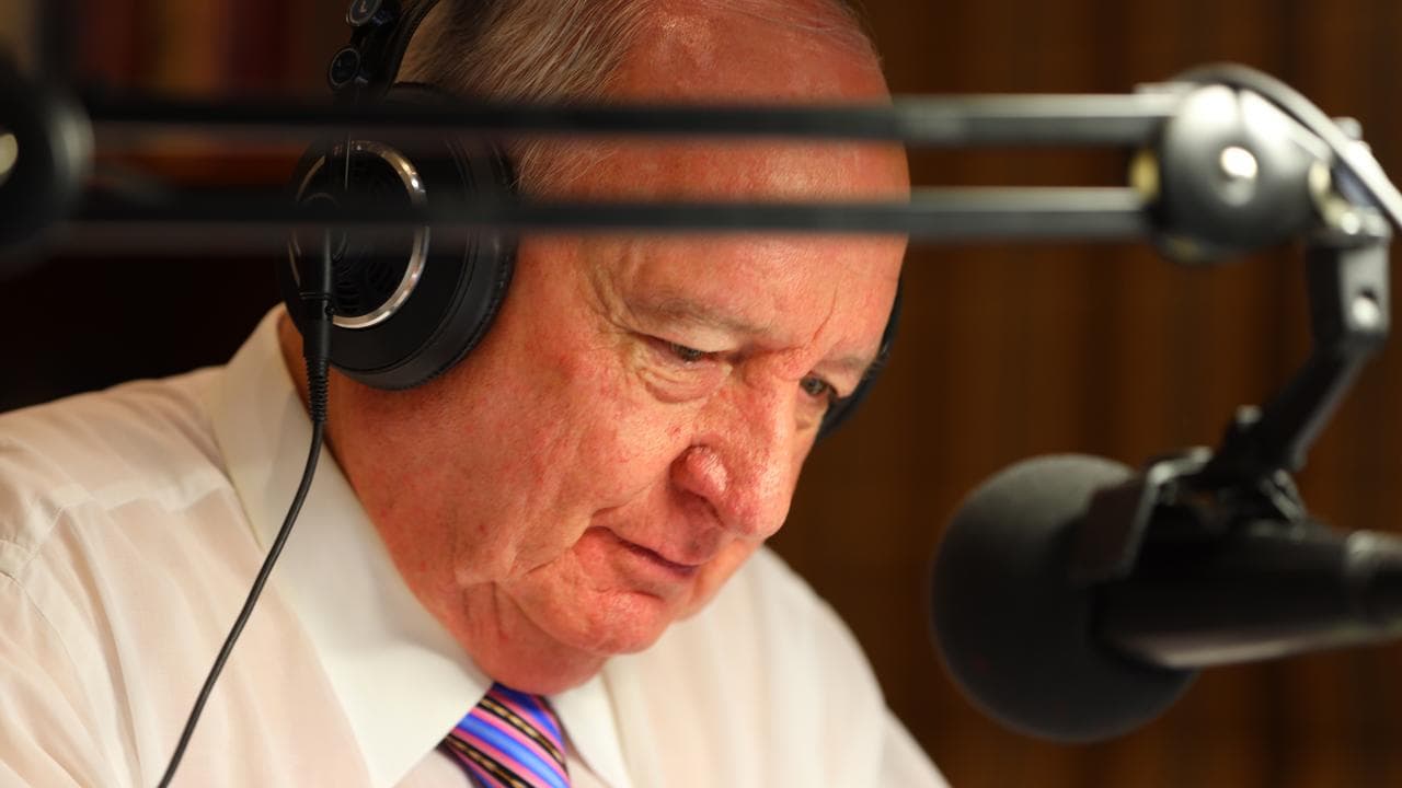 Alan Jones behind mic