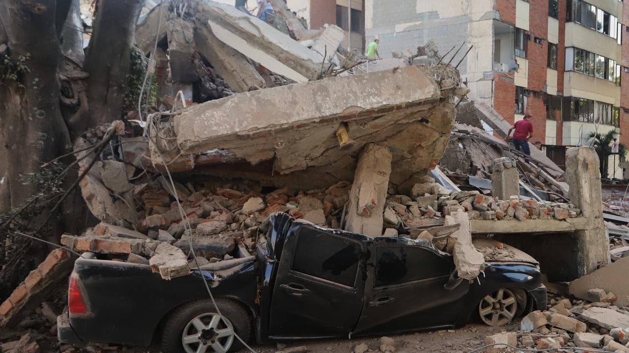 A vehicle is crushed after an earthquake struck Cali, Colombia