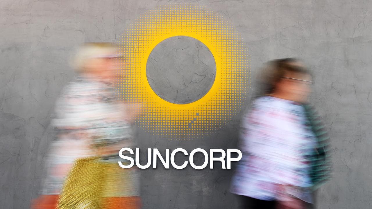 People walk past a Suncorp sign (file image)