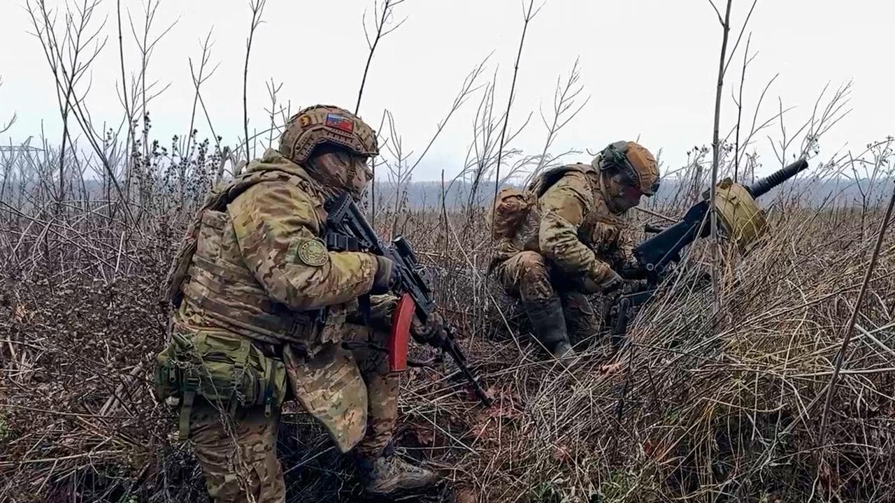 Russian soldiers prepare to fire a grenade launcher