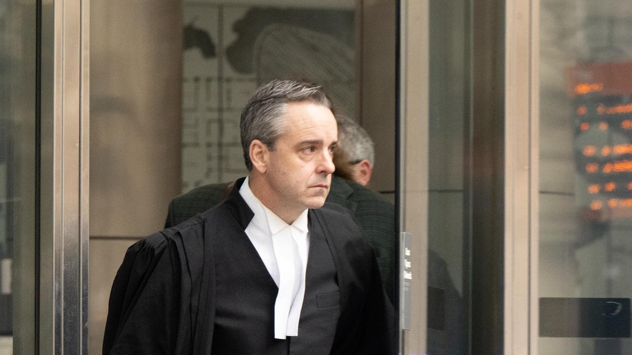 lawyer walks out courthouse