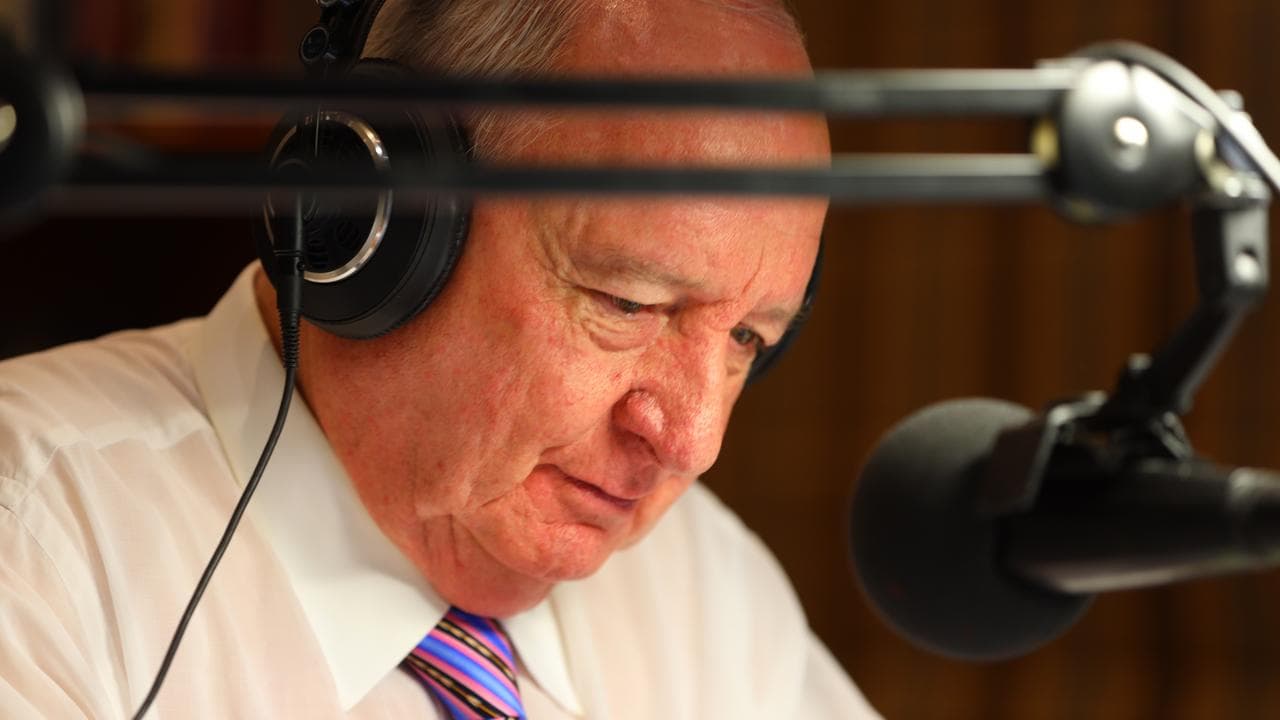 Alan Jones behind mic