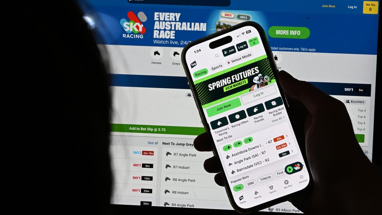 Sports gambling apps are seen on a iPhone