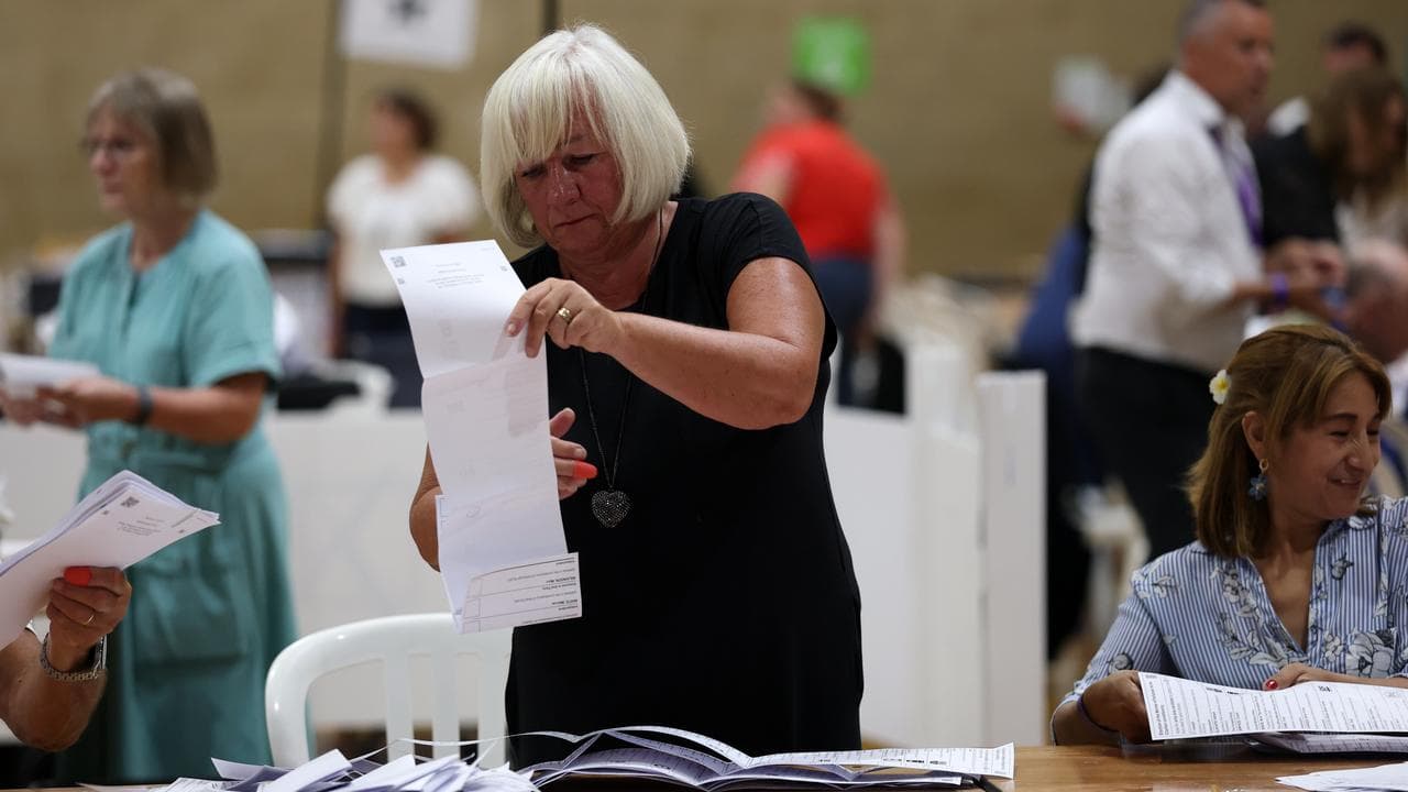 Volunteers count votes during the Clacton by-election count