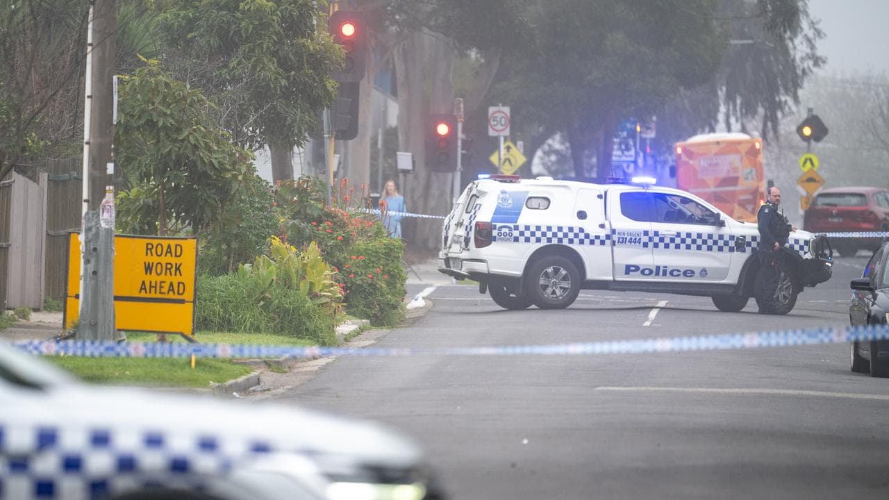 Police close off a street at a crime scene