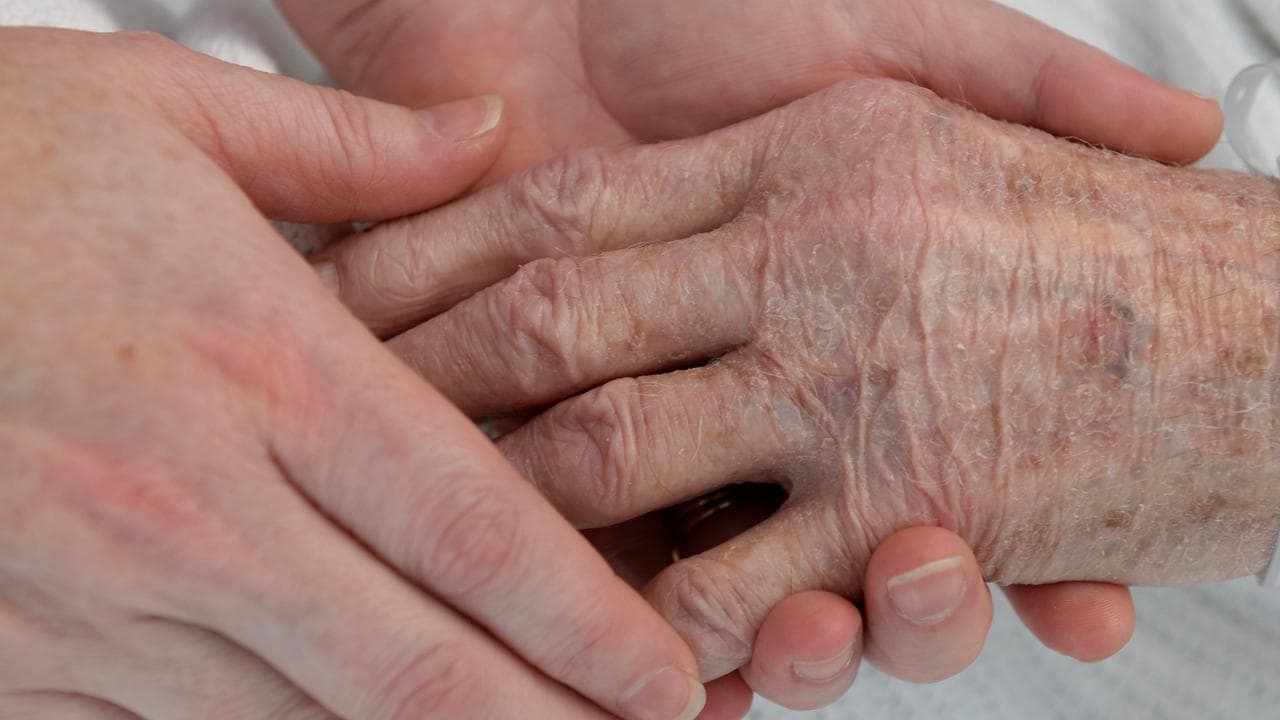 People holding hands (file image)