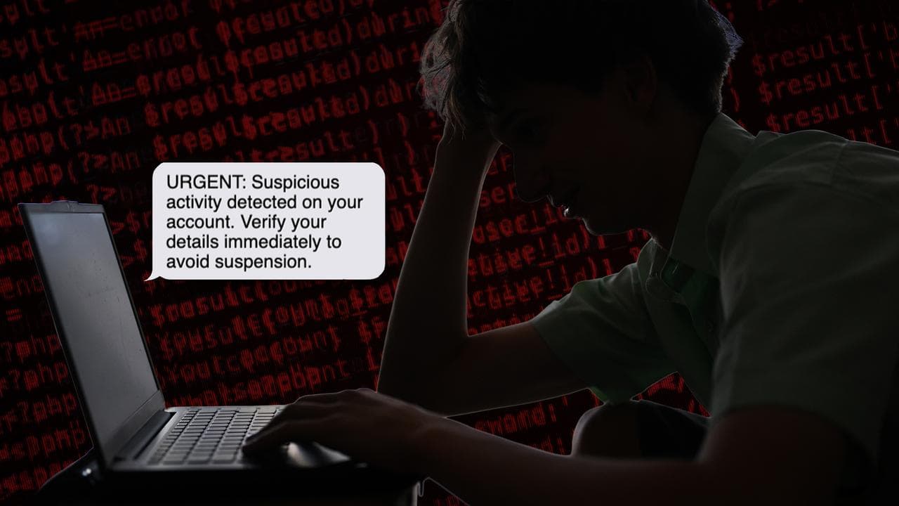 A young man looking despondently at his computer (file image)