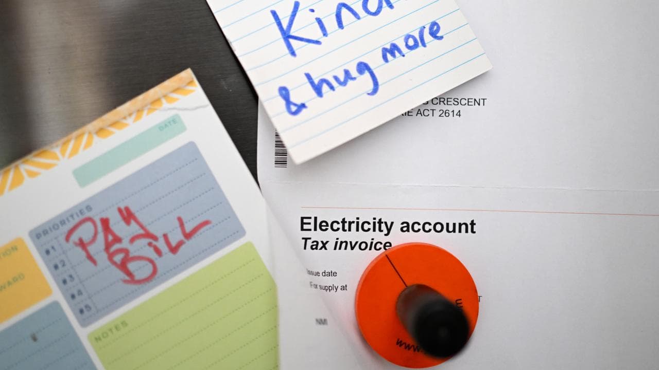 A power bill stuck to a fridge door (file image)