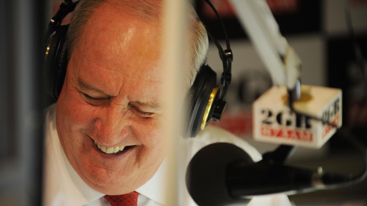 Alan Jones behind mic