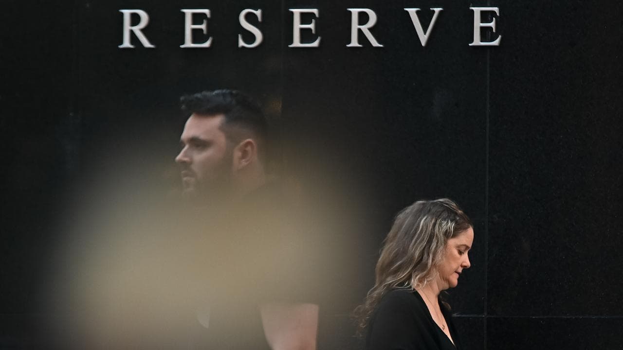 People walk past the Reserve Bank of Australia in Sydney