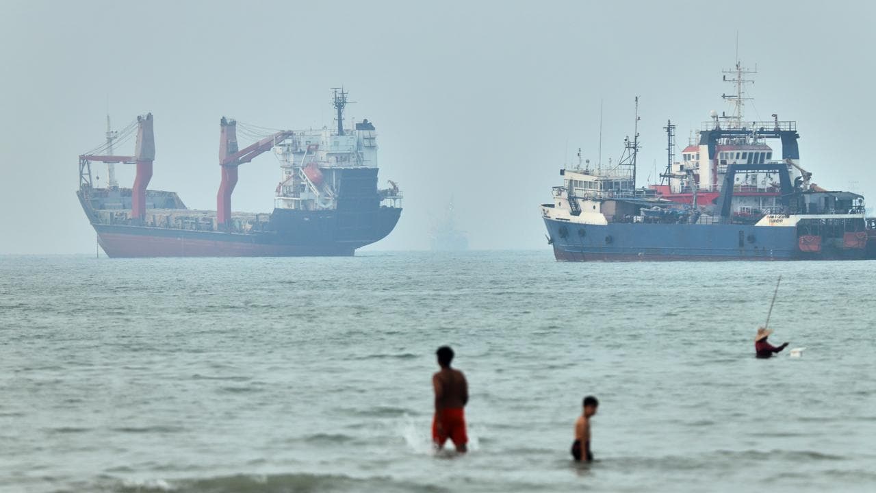 Cargo ships at anchor in the Strait of Hormuz
