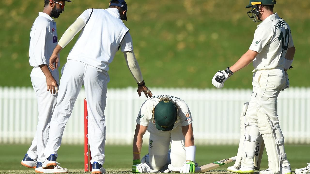 Pucovski on all fours after ball struck his helmet 