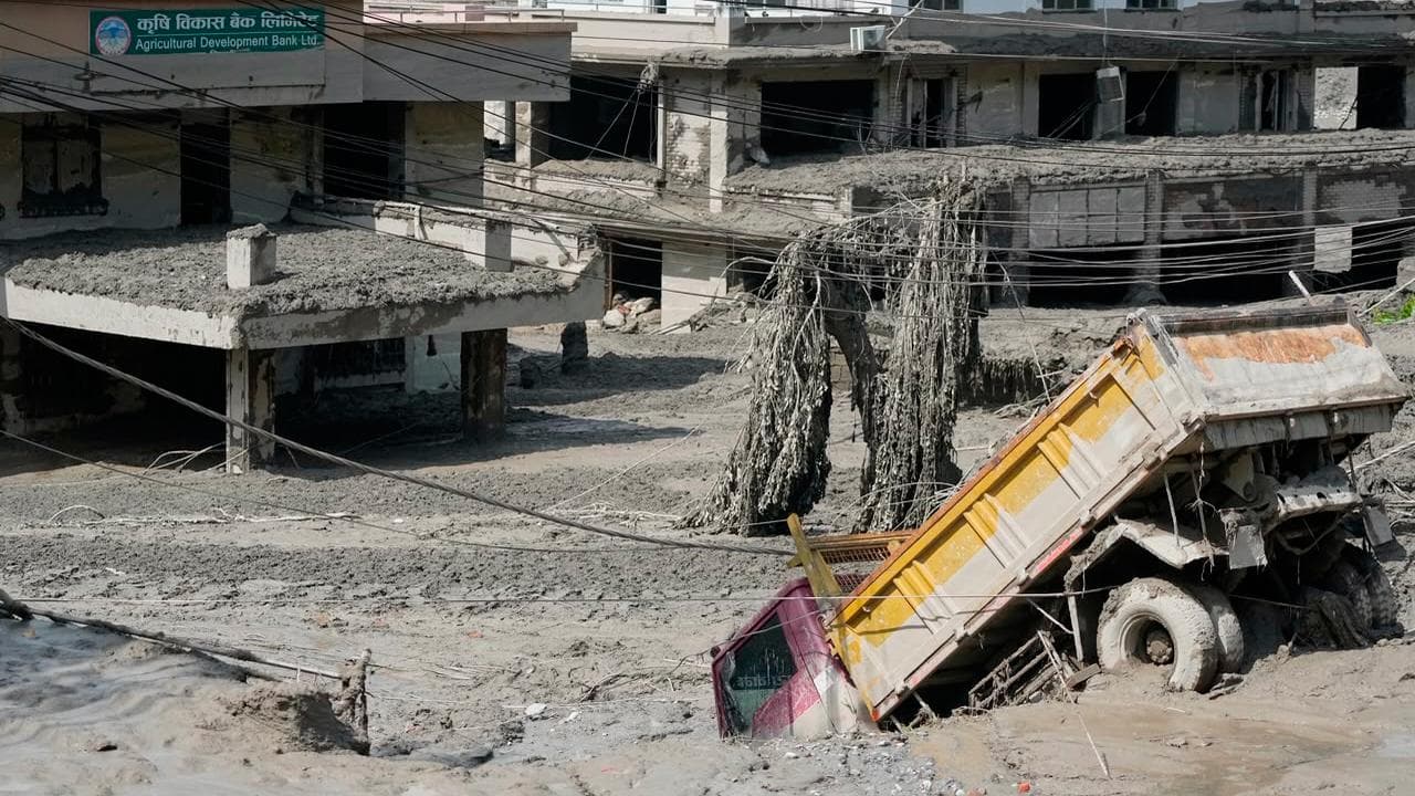 Damaged houses and vehicles after flash floods in Nepal