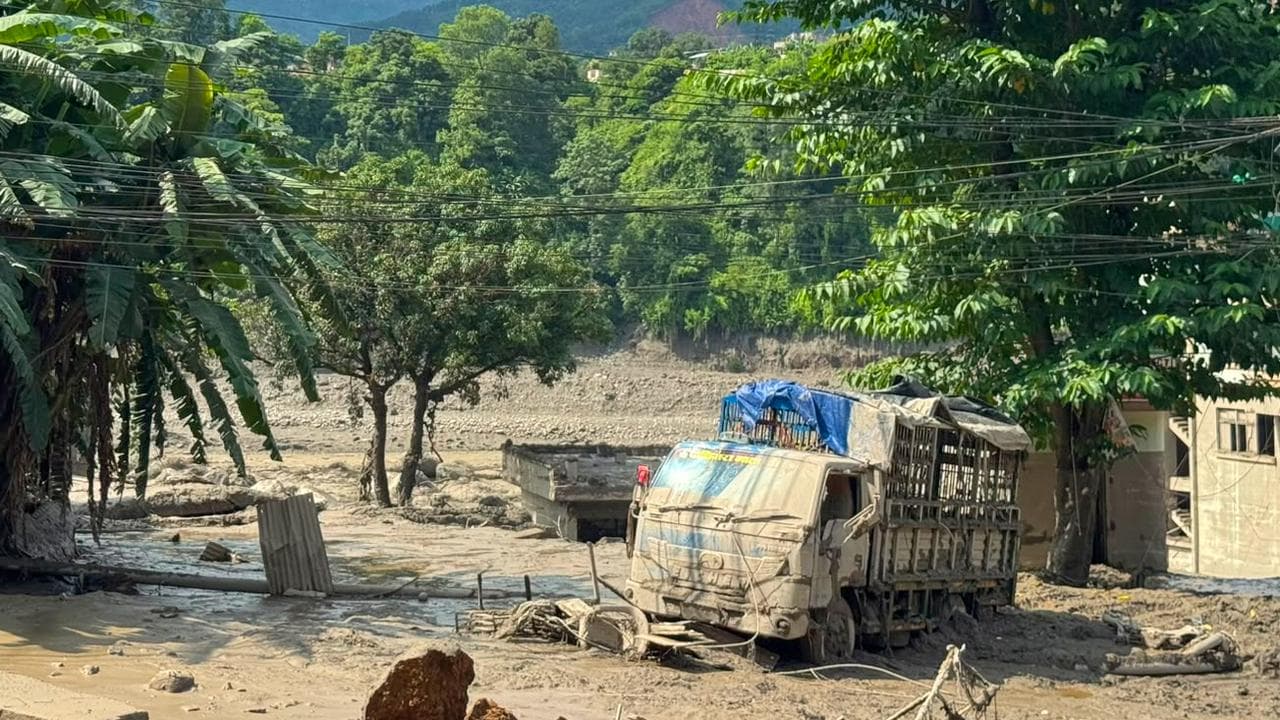 Damaged houses and vehicles after flash floods in Nepal