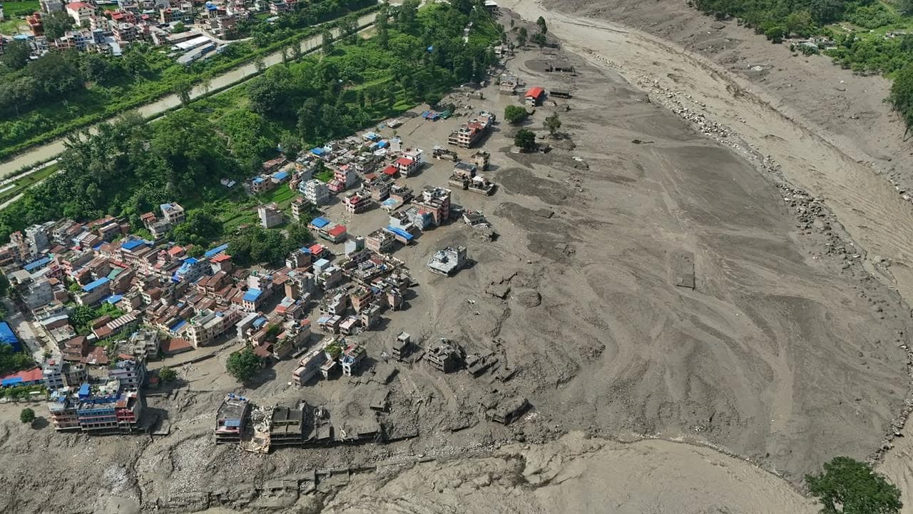 Damaged houses near the swollen Trishuli River in Nepal