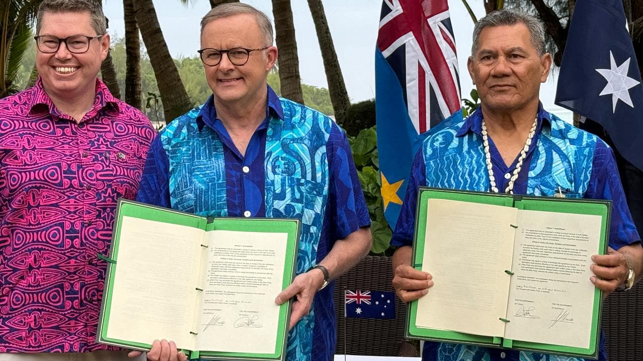 Politicians holding signed agreements