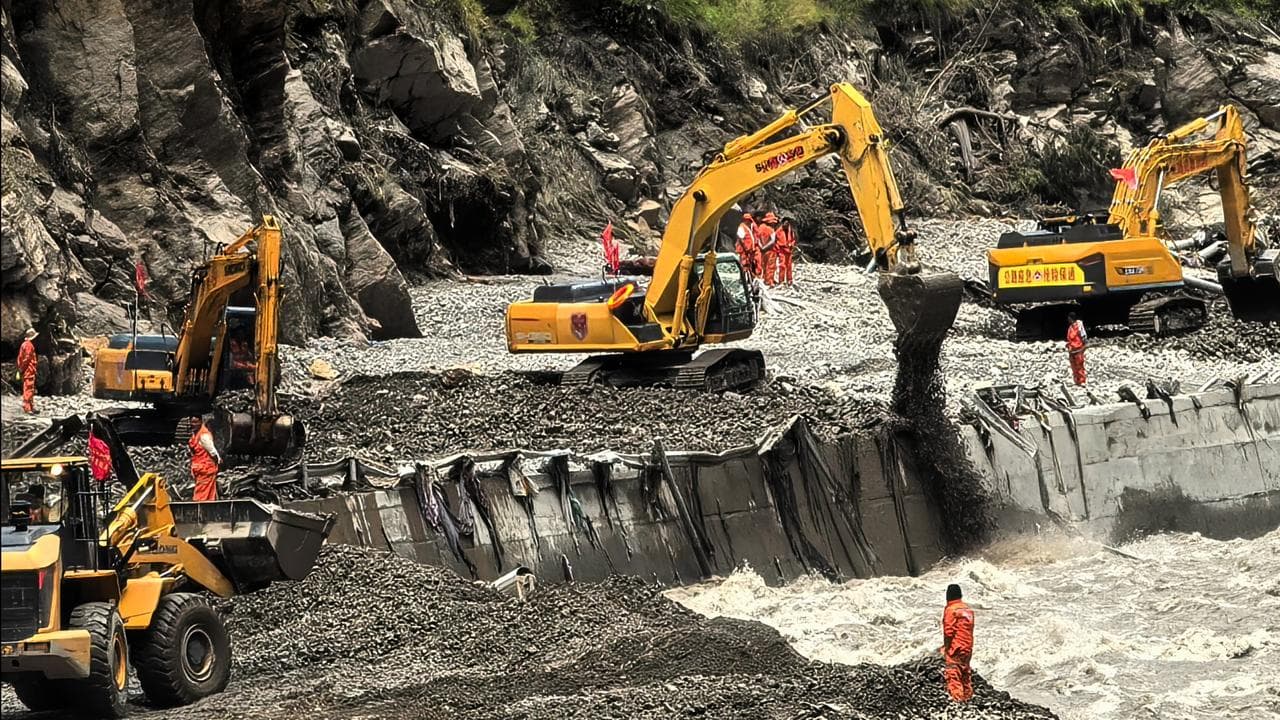 Heavy machines to clear a road to mudslide-hit areas in Xigaze, CHina