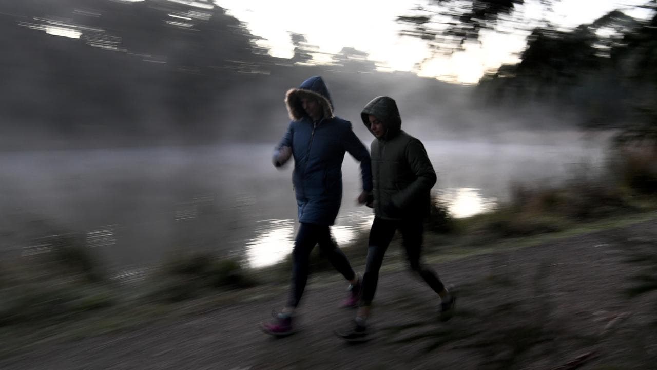 Two early walkers brave the cold weather