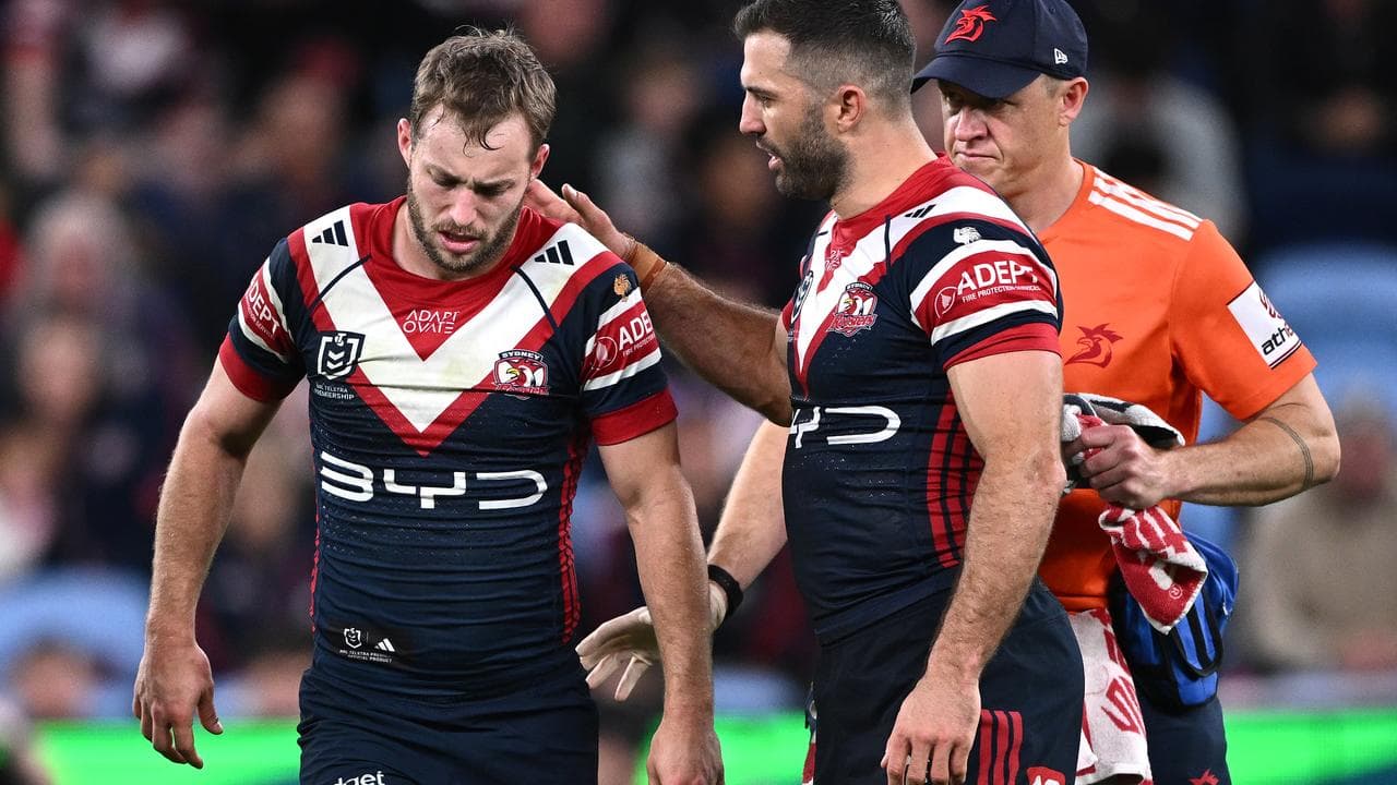 Sam Walker of the Roosters (l)