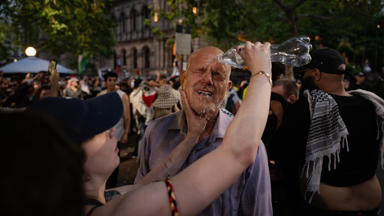 Protesters react after being exposed to pepper spray (file image)