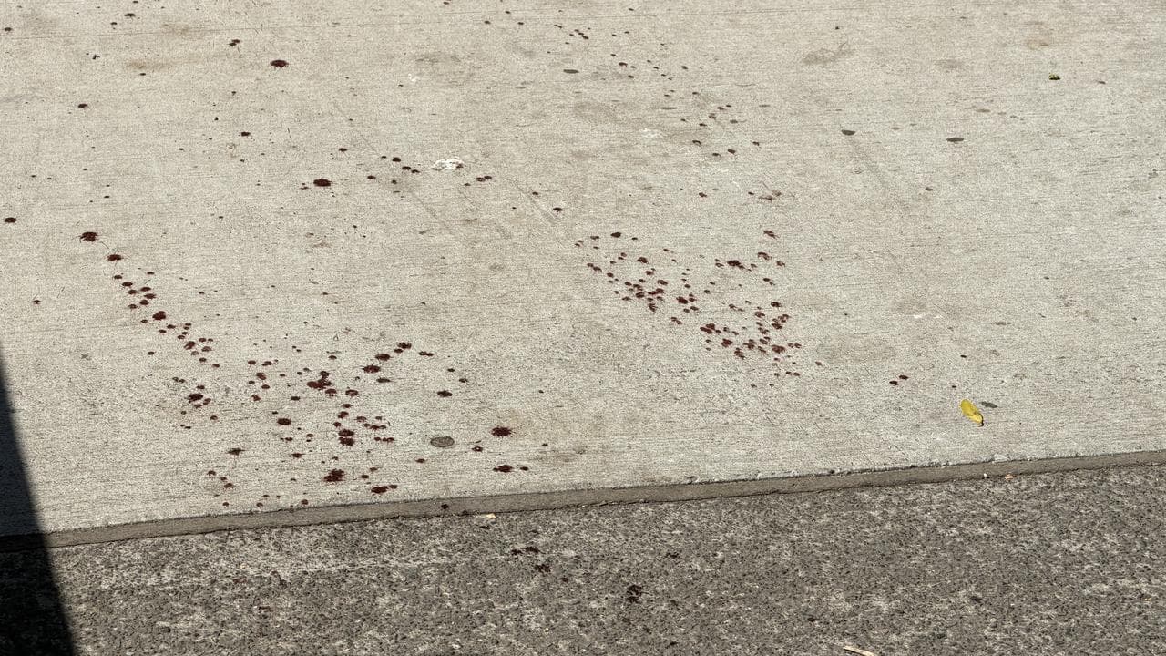 Red splatter on concrete